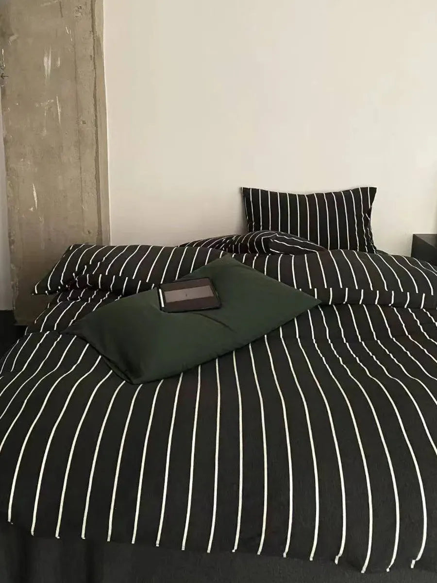 Black striped bedding set from Breezora featuring a stylish pattern on soft, comfortable linens for a modern bedroom look.
