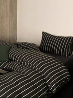 Black striped bedding set from Breezora featuring a cozy, stylish design perfect for a modern bedroom.