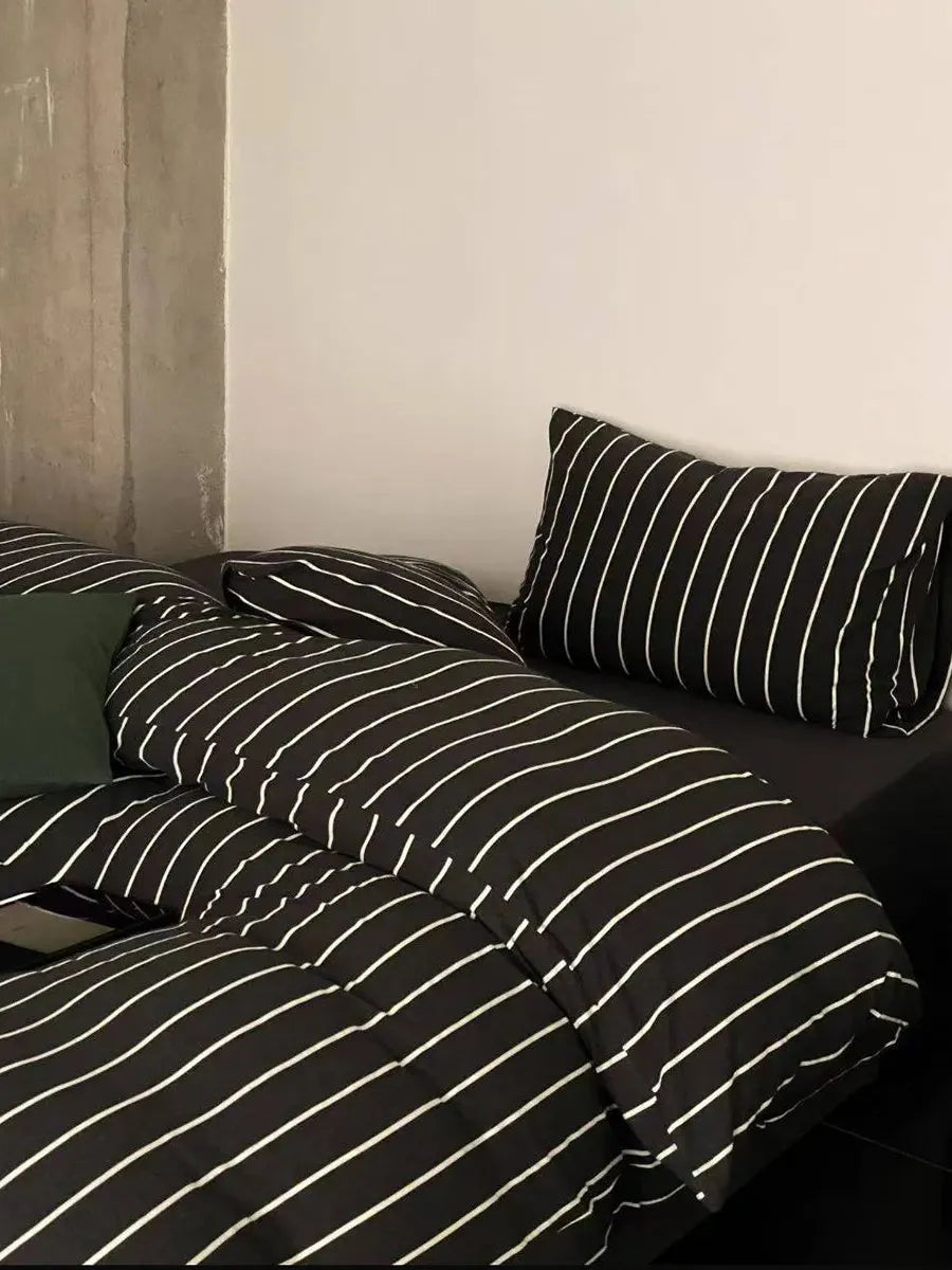 Black striped bedding set from Breezora featuring a cozy, stylish design perfect for a modern bedroom.