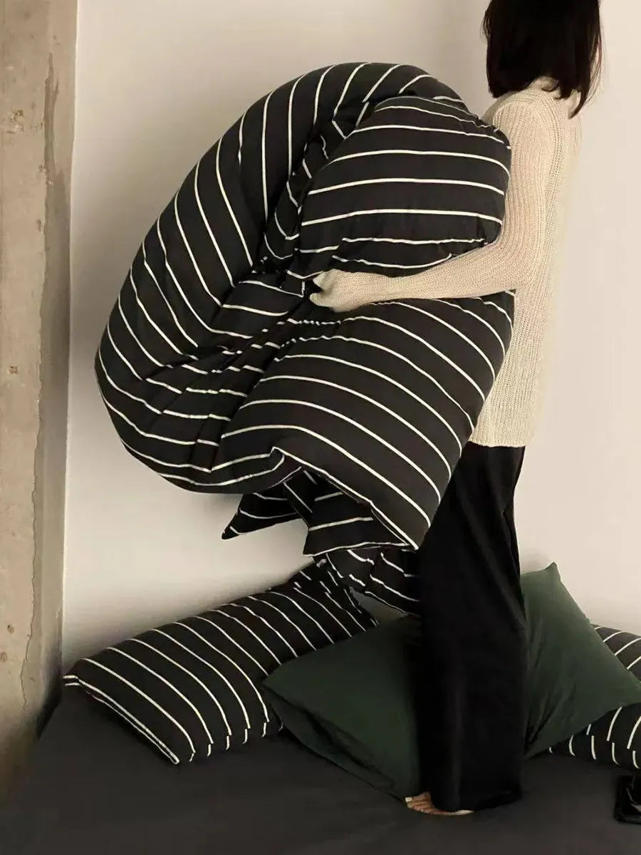 Black striped bedding set by Breezora featuring a cozy, stylish design with bold black and white stripes for a modern bedroom look.