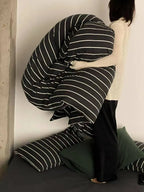 Black striped bedding set by Breezora featuring a cozy, stylish design with bold black and white stripes for a modern bedroom look.