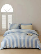 Breezora mixed blue striped bedding set featuring a vibrant pattern with matching pillowcases and duvet cover.