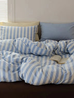 Breezora mixed blue striped bedding set featuring a stylish design with various shades of blue and white stripes.