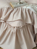 Boho linen lace bedding set by Breezora featuring intricate lace details and a soft, textured finish.