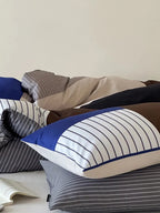 Breezora contrast striped bedding set featuring bold stripes in a stylish arrangement on a neatly made bed.