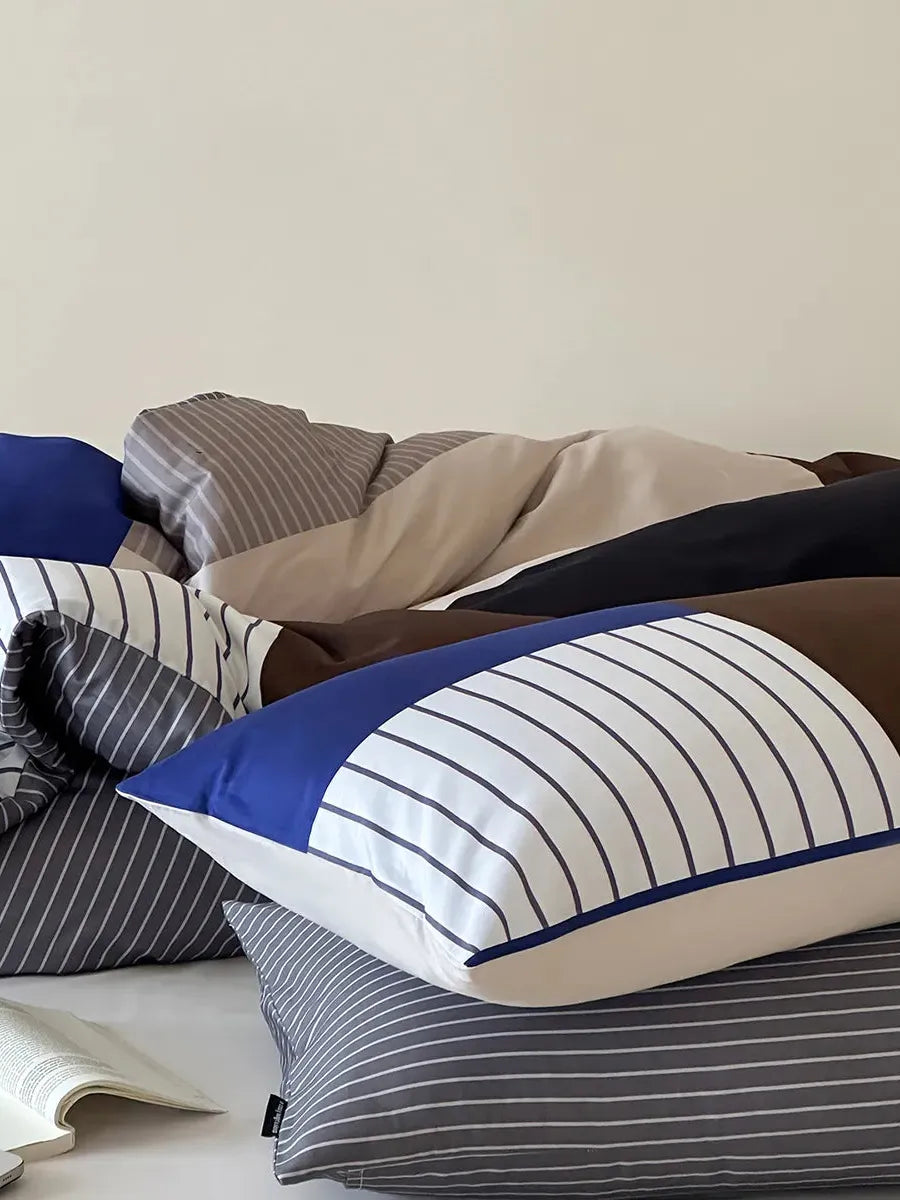 Breezora contrast striped bedding set featuring bold stripes in a stylish arrangement on a neatly made bed.