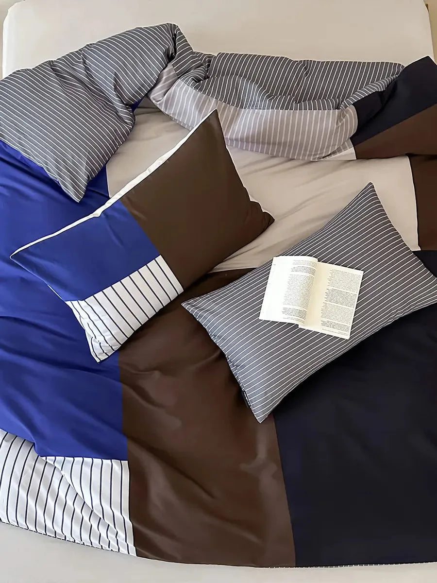 Contrast striped bedding set by Breezora featuring bold stripes and soft fabric in a cozy bedroom setting.