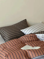 Breezora contrast striped bedding set featuring a stylish design with bold stripes in soft fabric.