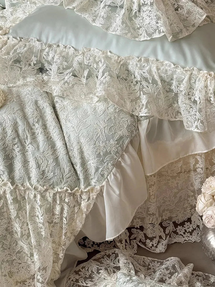 Breezora Rococo layered lace bedding set featuring intricate lace patterns and soft fabric in a serene bedroom setting.
