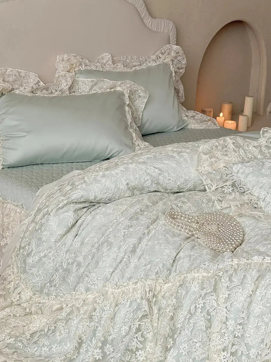 Breezora Rococo layered lace bedding set featuring intricate lace details and soft pastel colors on a plush bed.