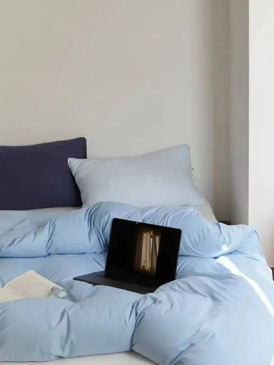 Breezora mixed color bedding set with matching pillowcases and duvet cover, vibrant and soft fabric for a cozy bedroom look.