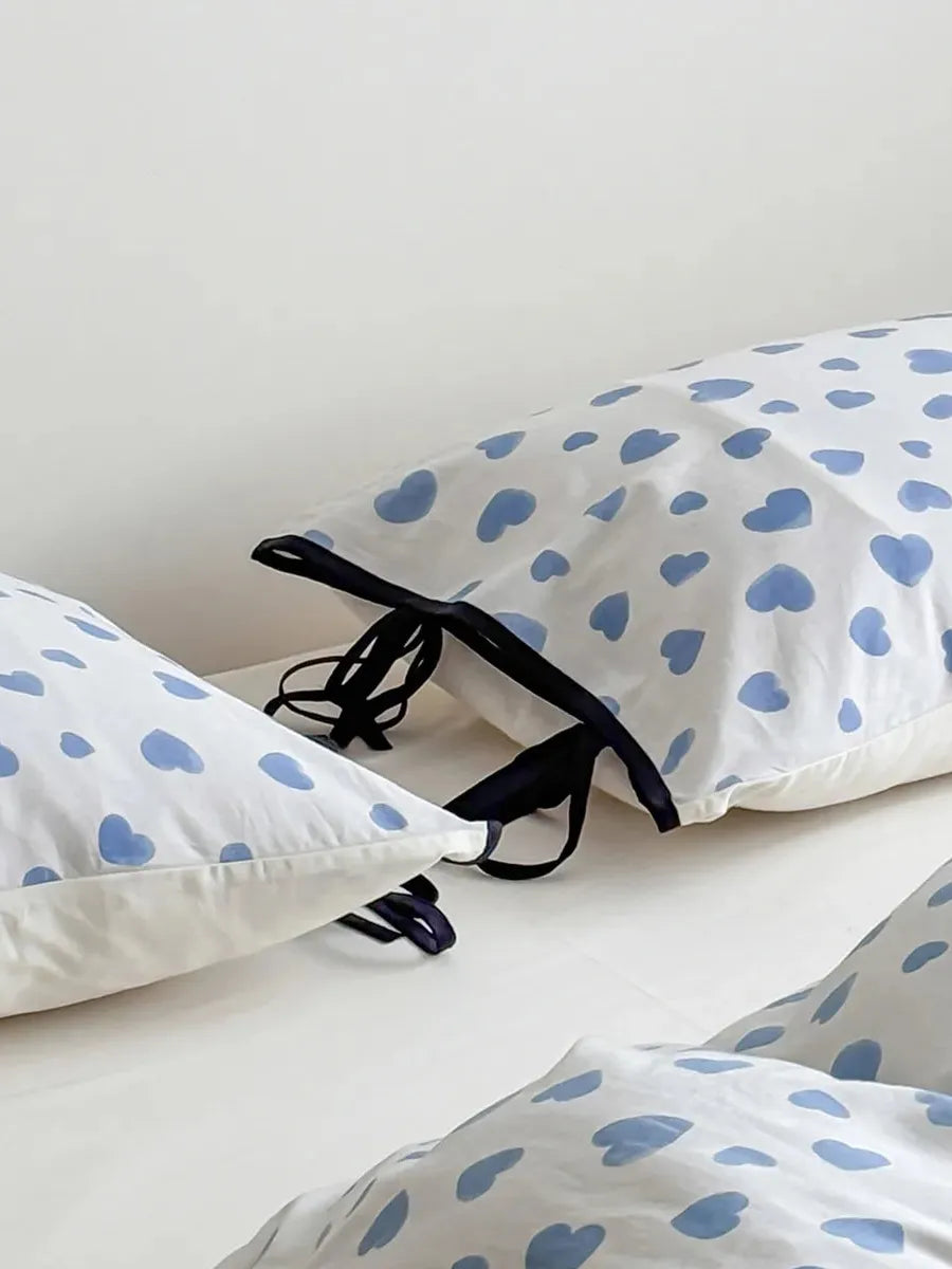 Moody Heart Printed Bedding Set by Breezora featuring a cozy design with heart patterns in soft colors.