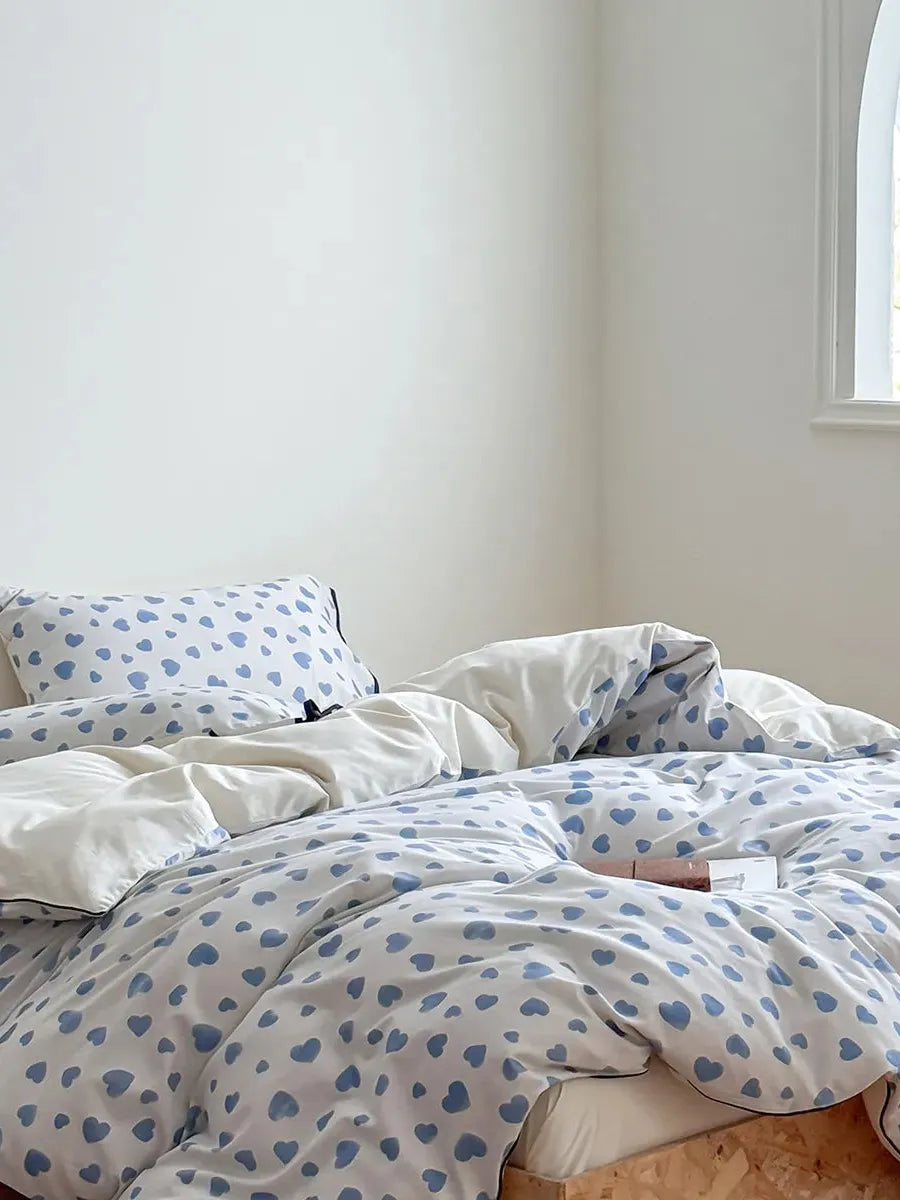 Moody Heart Printed Bedding Set by Breezora featuring a stylish heart pattern on soft fabric for a cozy bedroom look.