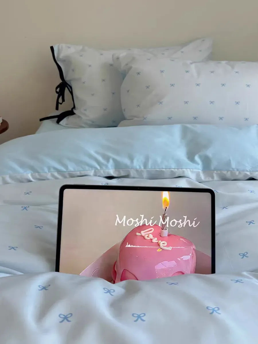 Breezora Odette Mini Bow bedding set with soft pastel colors and bow details, includes duvet cover and pillowcases for a charming bedroom look.