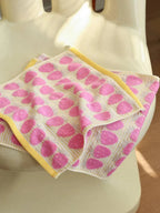 Pink Sunny Strawberry hand towel from Breezora with a vibrant strawberry print, soft and absorbent for kitchen or bathroom use.