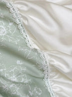 Breezora Princess Ruched Bedding Set with Lace featuring soft ruffles and elegant lace trim in a pastel color scheme.