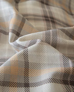 Retro plaid bedding set by Breezora featuring a vibrant checkered pattern in warm colors on a soft fabric.