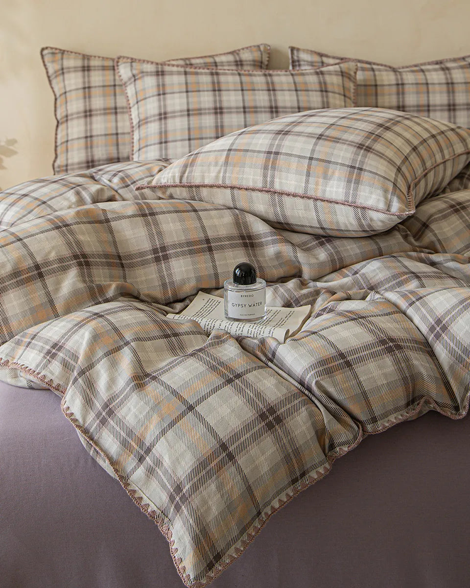 Retro plaid bedding set by Breezora featuring vibrant colors and classic patterns, perfect for a cozy bedroom look.