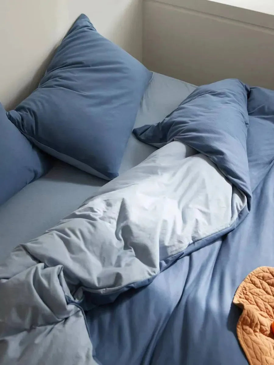 Reversible jersey cotton bedding set by Breezora featuring soft, cozy fabric with a two-tone design and matching pillowcases.