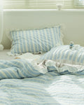 Striped jacquard bedding set featuring lace ruffle by Breezora, showcasing intricate patterns and elegant design.