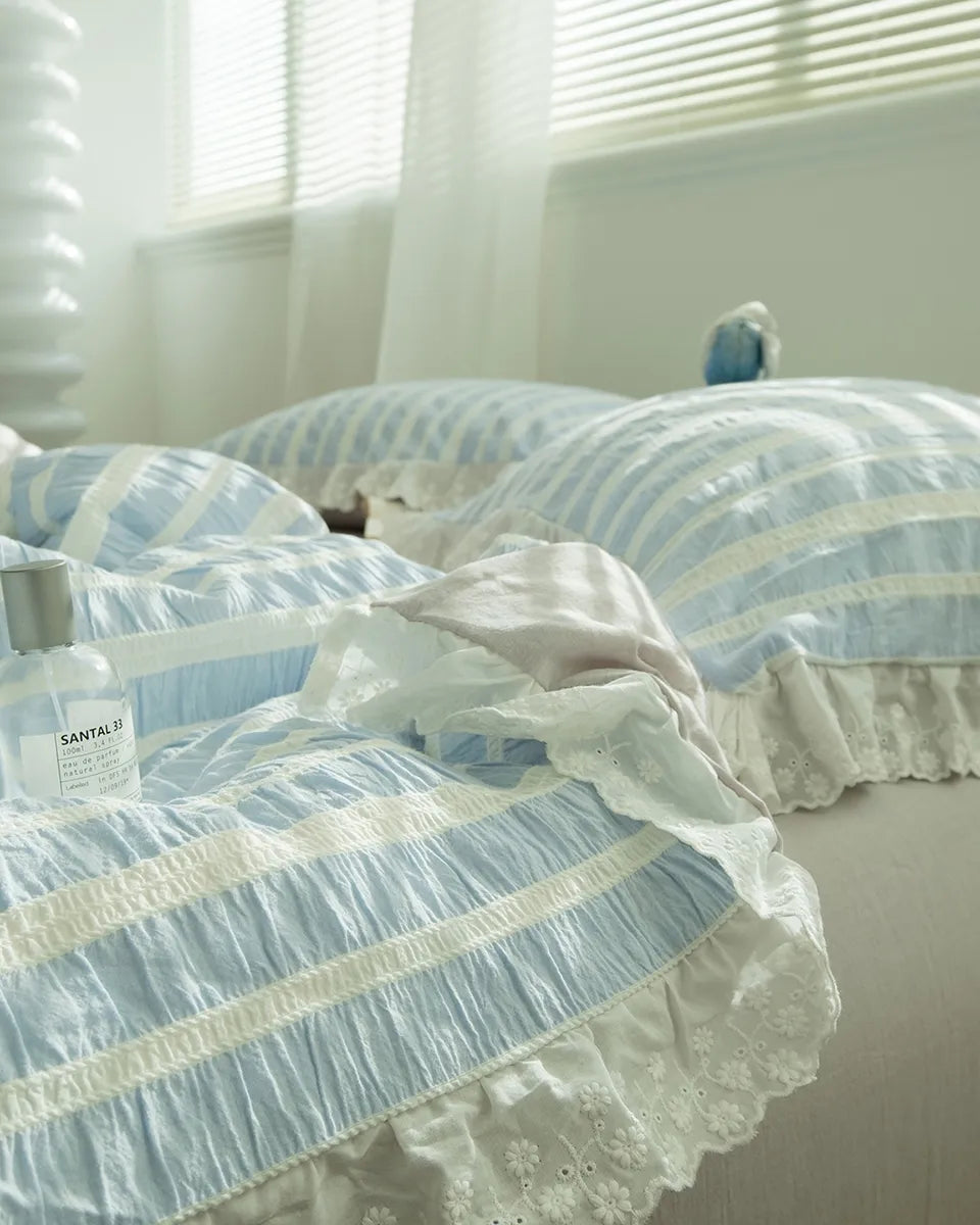 Breezora striped jacquard bedding set featuring elegant lace ruffle details on a soft, textured fabric.