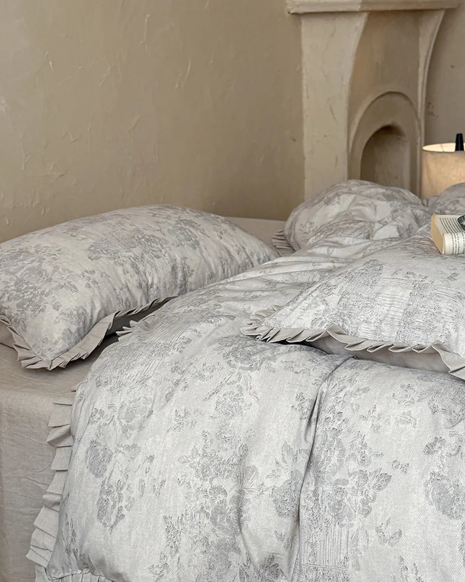 Breezora vintage floral bedding set featuring a delicate flower pattern on soft fabric with coordinating pillowcases.