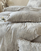 Vintage floral bedding set from Breezora featuring intricate flower patterns on soft fabric for a cozy bedroom aesthetic.