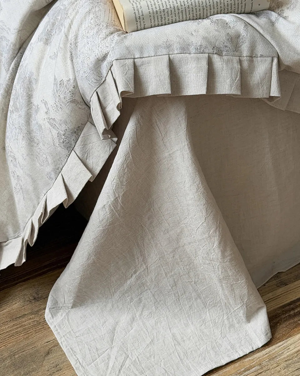 Breezora vintage floral bedding set featuring delicate flowers on soft fabric, styled with matching pillowcases and comforter.