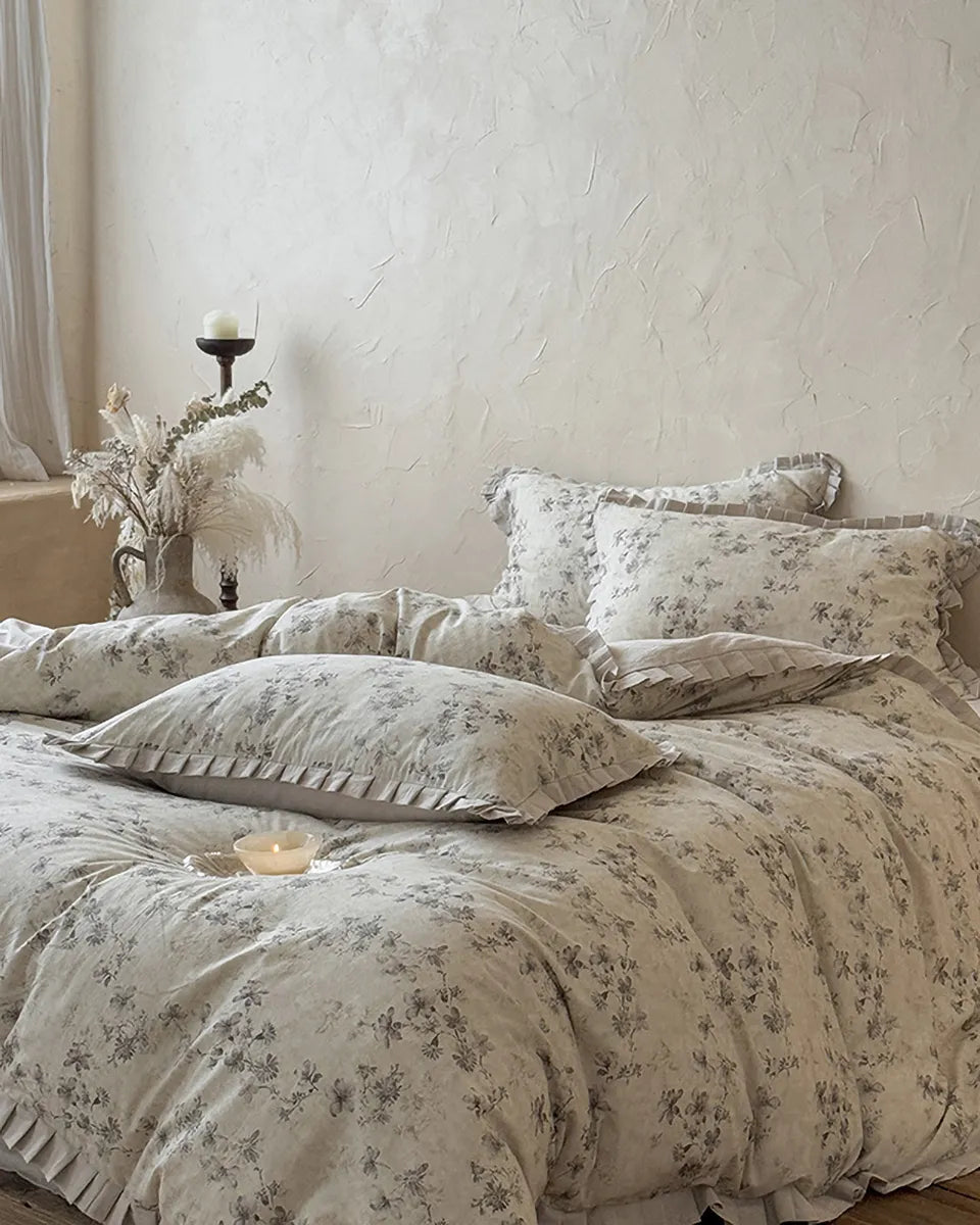 Vintage floral bedding set by Breezora featuring intricate flower patterns in soft, muted colors on soft fabric.
