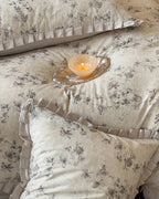 Breezora vintage floral bedding set featuring intricate patterns on a soft fabric with coordinating pillowcases.