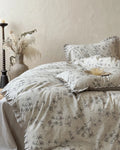 Vintage floral bedding set by Breezora featuring colorful blossoms on soft fabric, perfect for a cozy bedroom aesthetic.