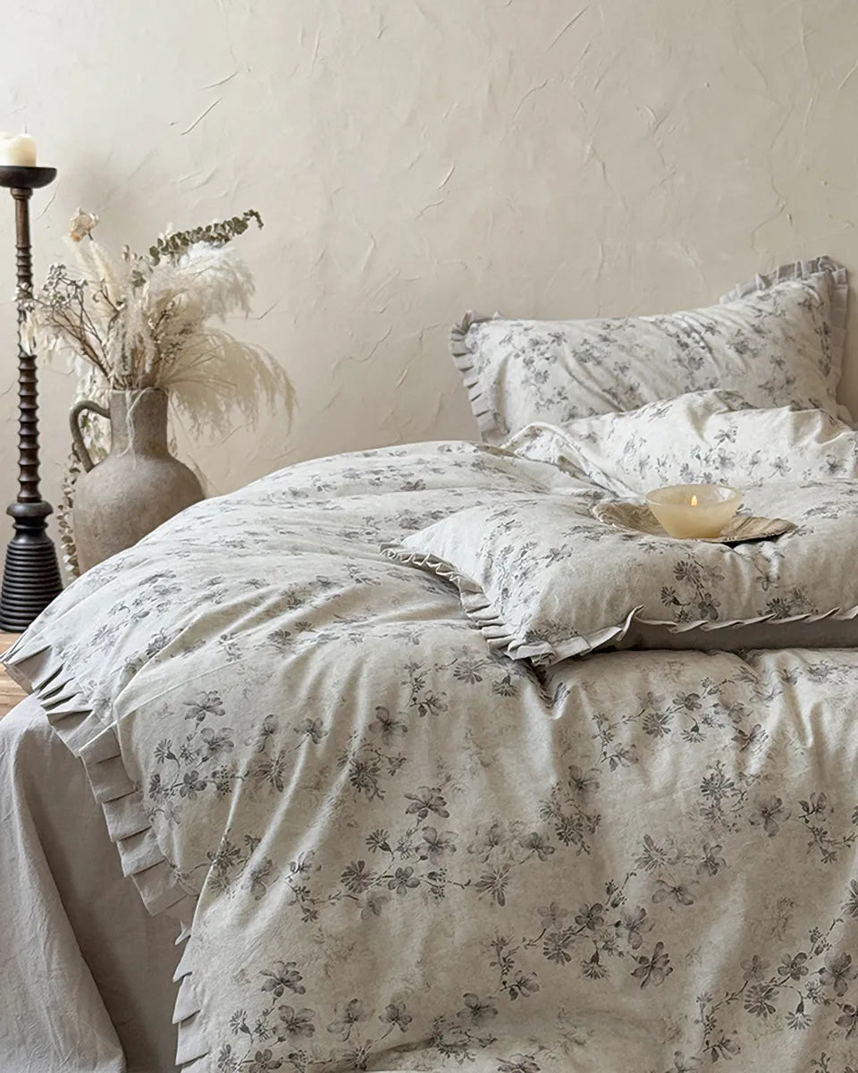 Vintage floral bedding set by Breezora featuring colorful blossoms on soft fabric, perfect for a cozy bedroom aesthetic.