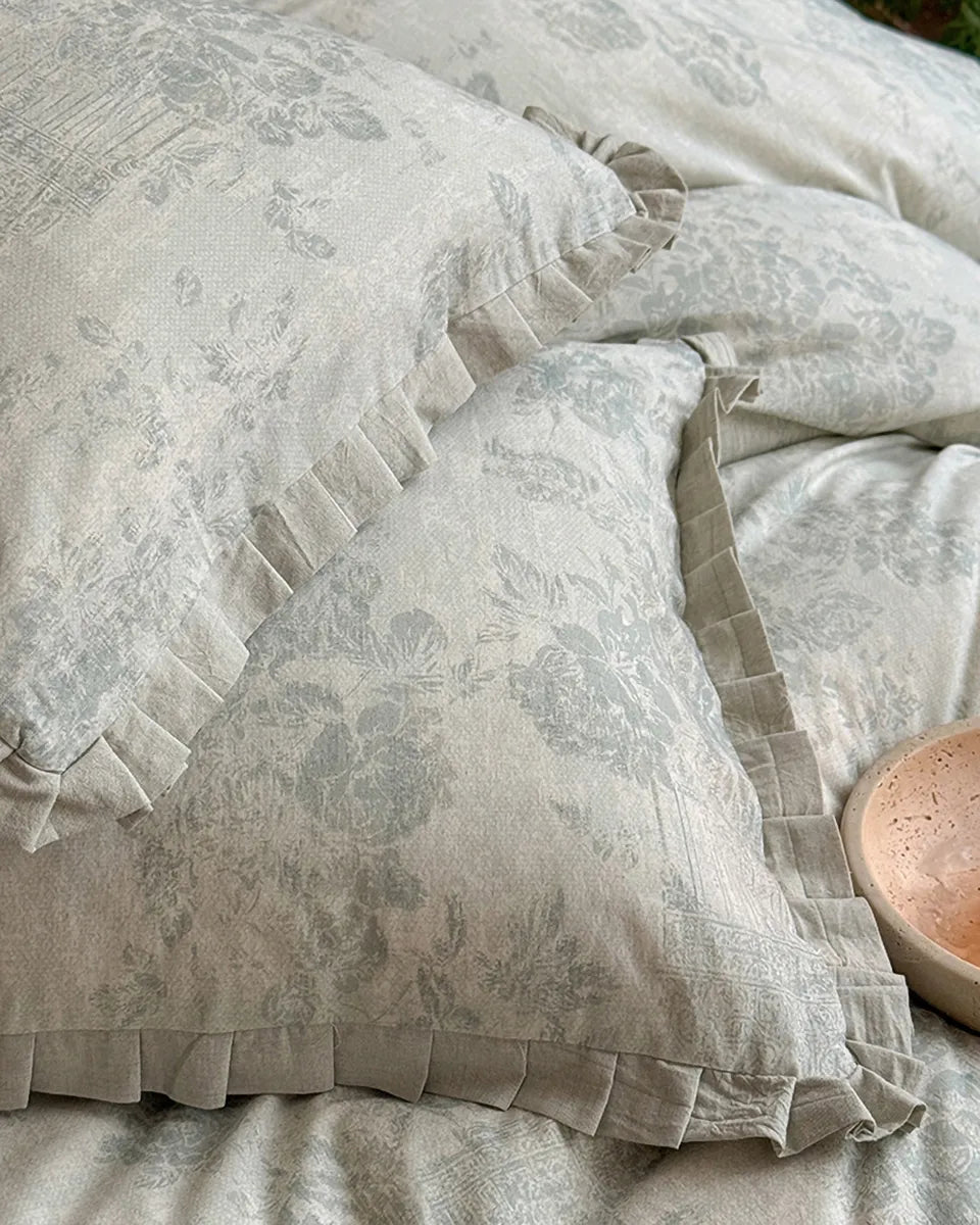 Breezora vintage floral bedding set featuring intricate patterns on a soft fabric, perfect for a cozy bedroom aesthetic.